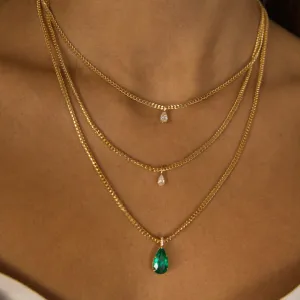 EMERALD PEAR PENDANT WITH DIAMOND BASKET AND BALE