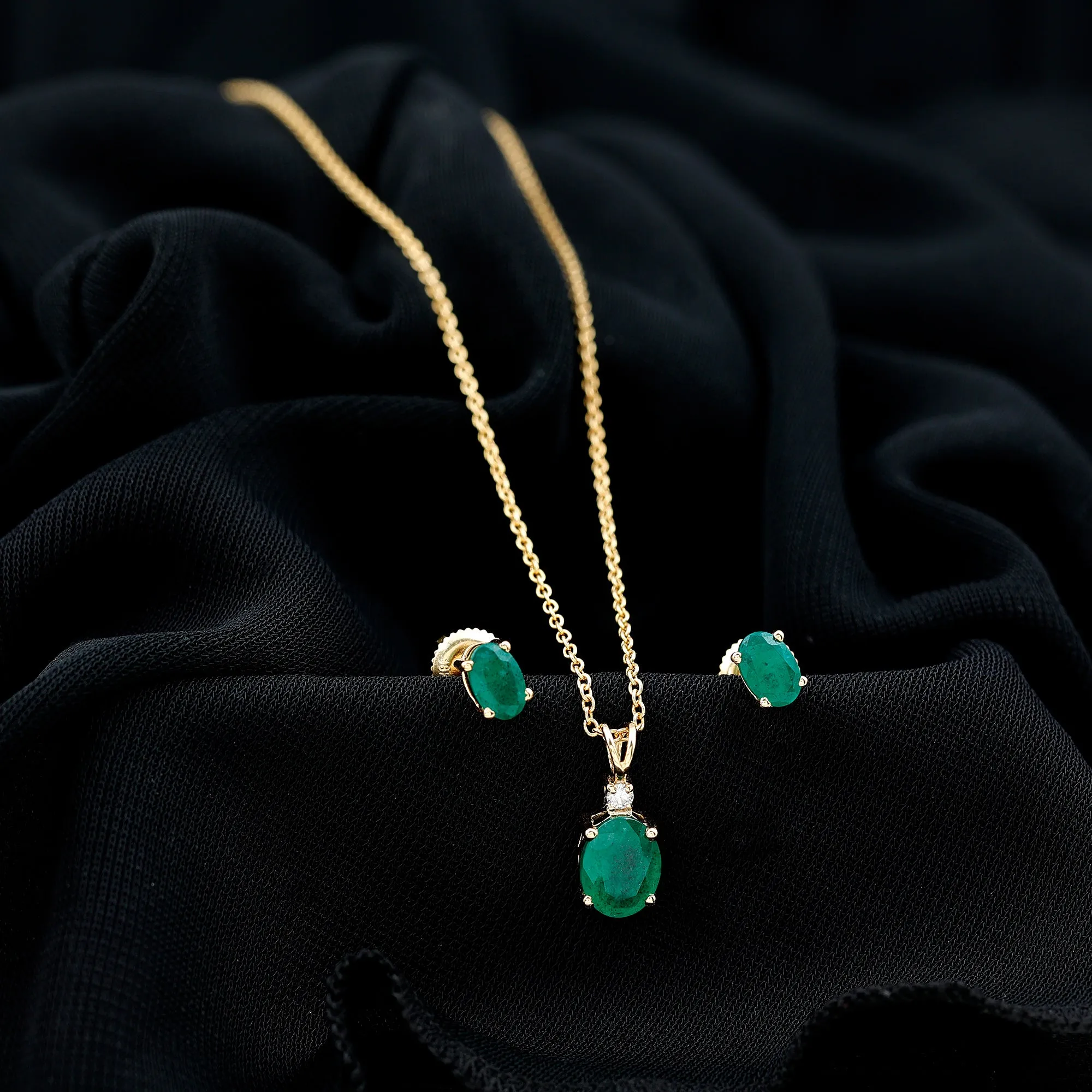 Oval Cut Emerald Solitaire Pendant and Earrings set with Moissanite