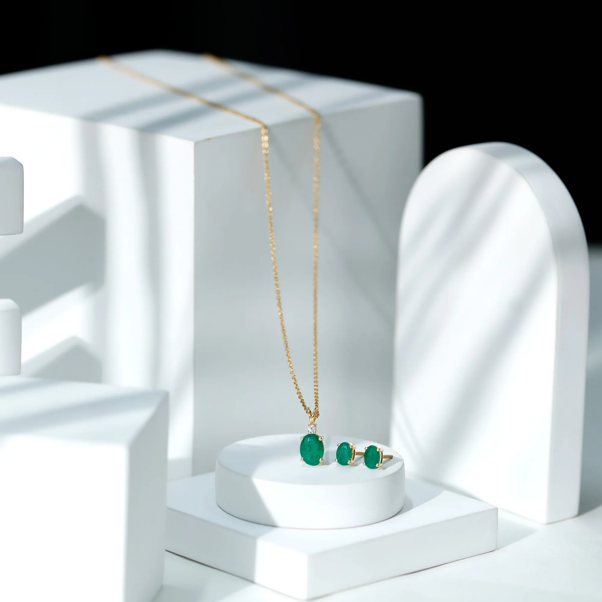 Oval Cut Emerald Solitaire Pendant and Earrings set with Moissanite