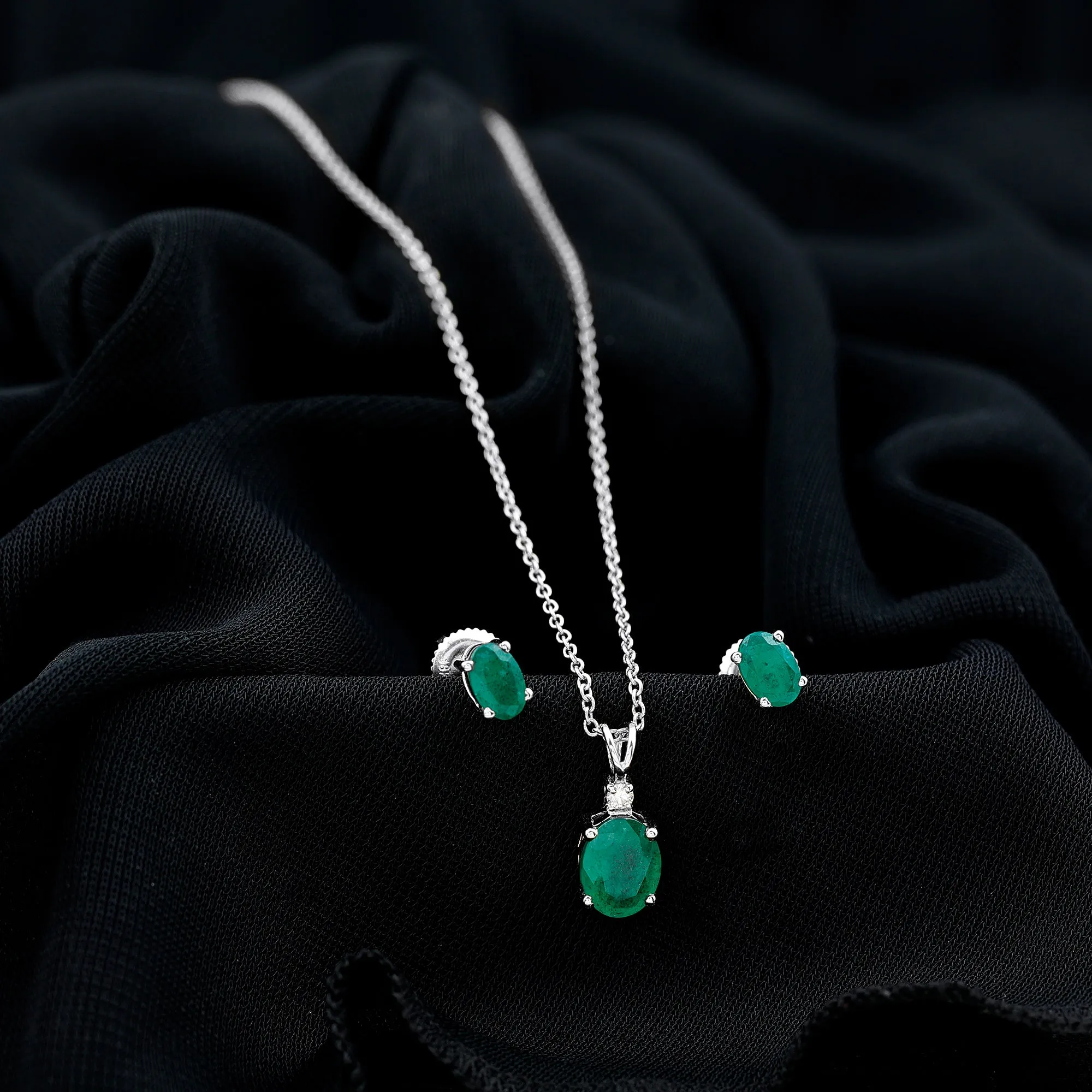 Oval Cut Emerald Solitaire Pendant and Earrings set with Moissanite